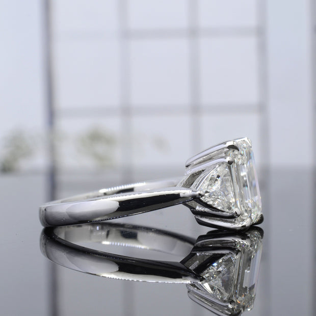 Emerald Cut 3 Stone Engagement Ring with Trillions Profile View