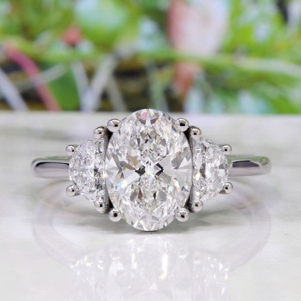 Oval Cut 3 Stone Diamond Ring with Half Moons