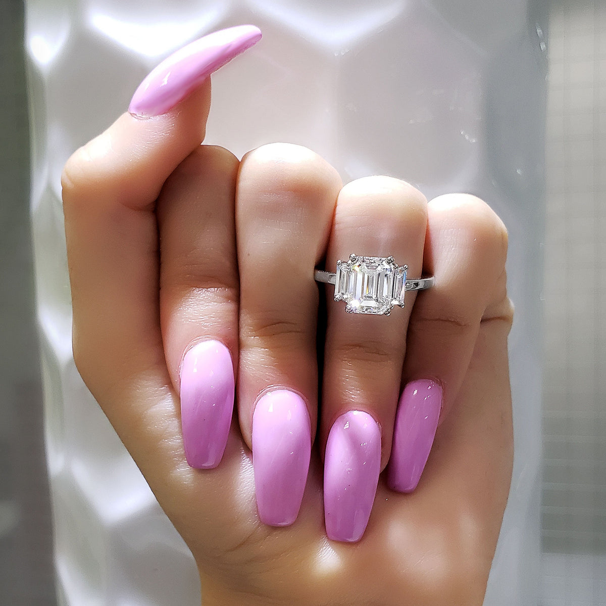 3 stone emerald cut engagement rings