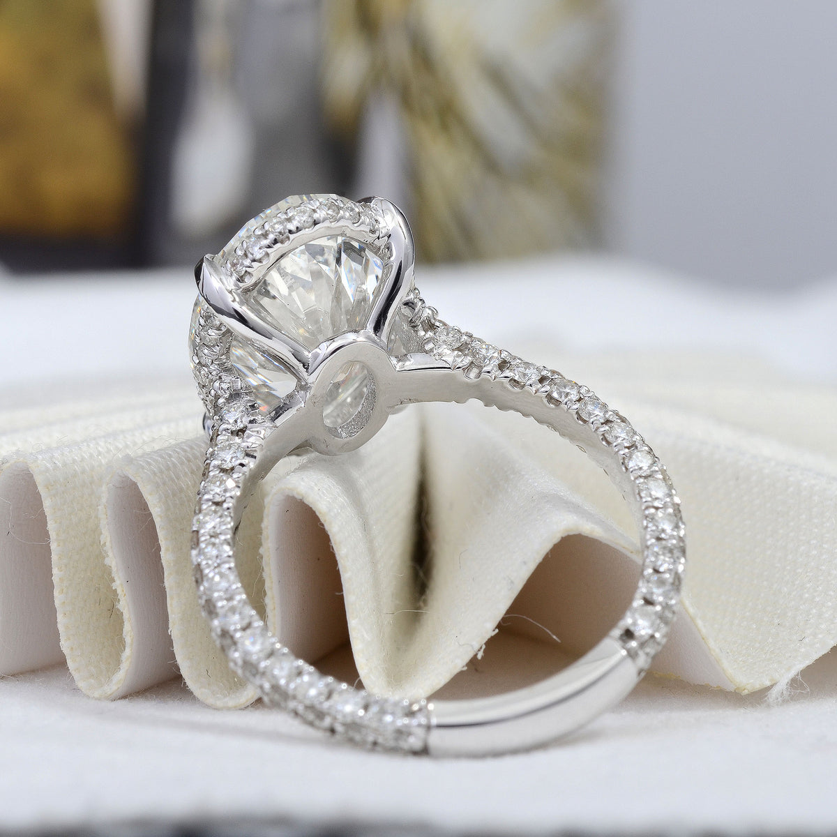 Hidden halo oval engagement ring