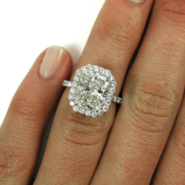 Radiant cut halo engagement rings