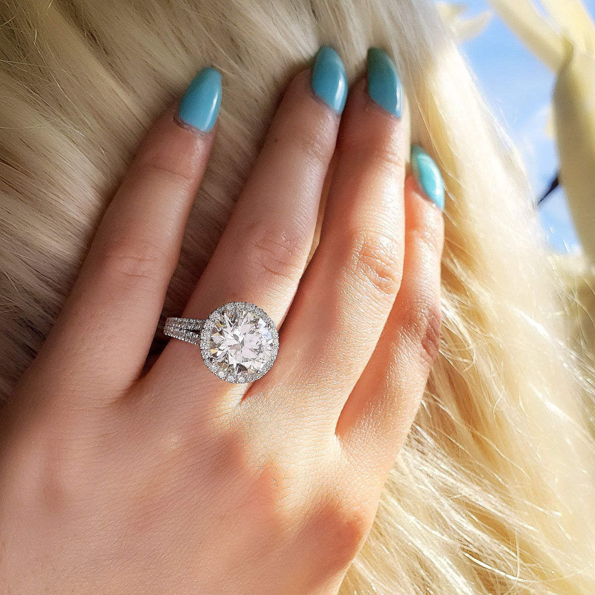 Round cut halo split shank diamond engagement ring