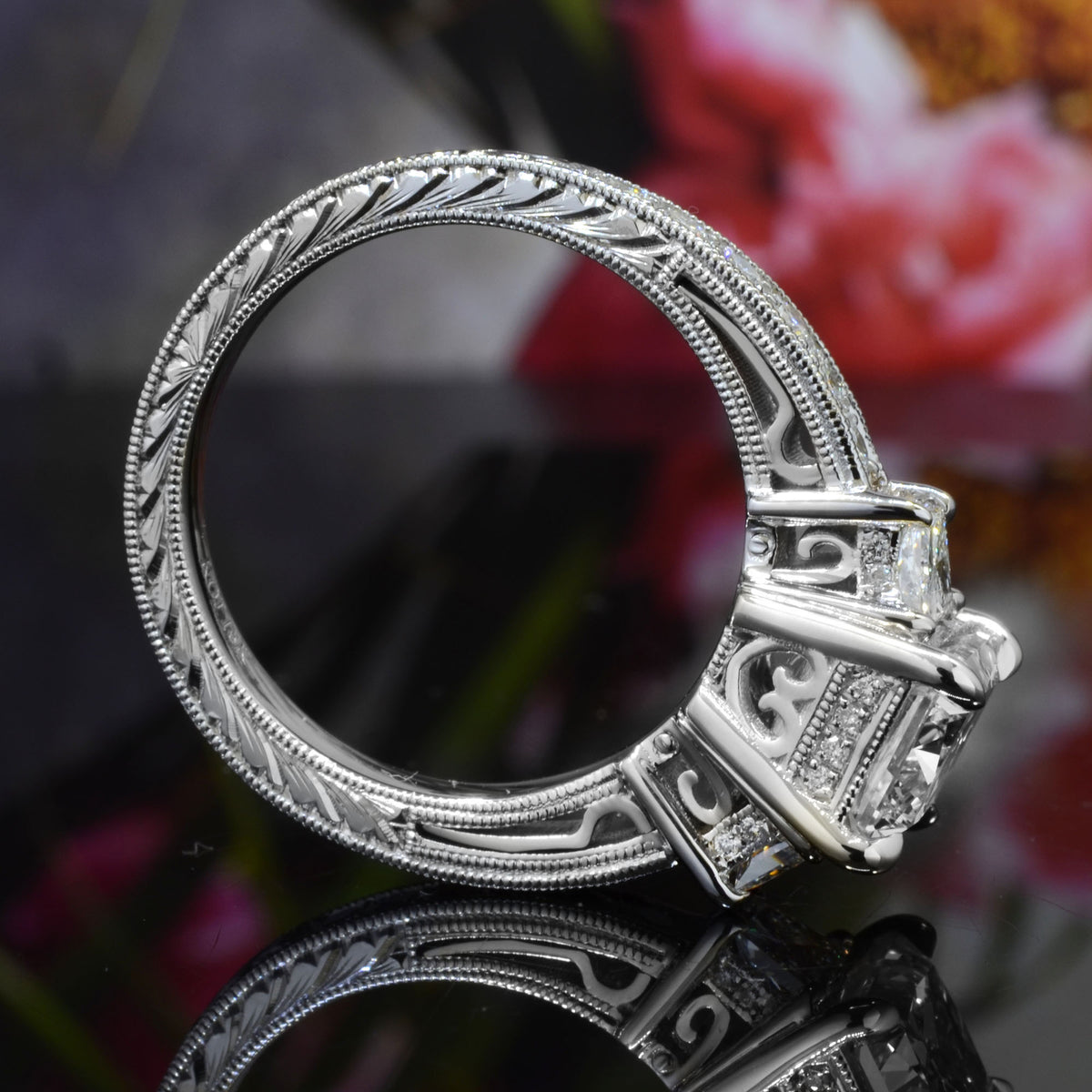 Platinum elongated radiant cut ring side view engravened 