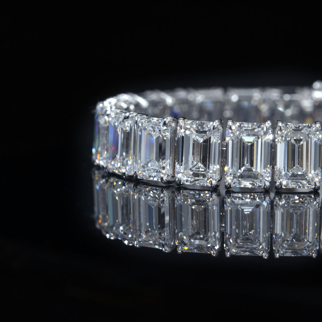 Emerald cut diamond tennis bracelet in white gold close up view