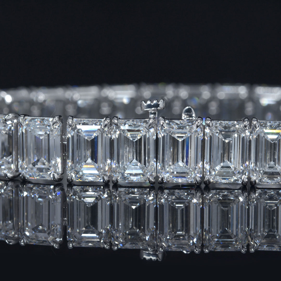 Emerald cut diamond tennis bracelet in white gold close up view