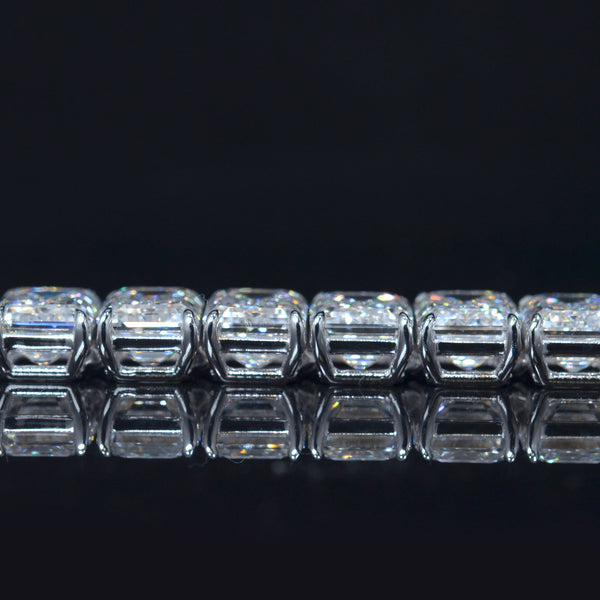 Emerald cut diamond tennis bracelet in white gold close up side view