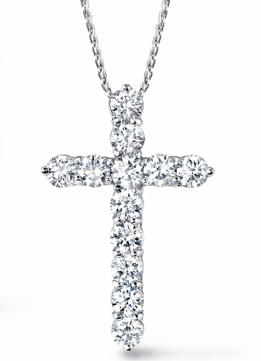 Diamond cross pendant on a white background
