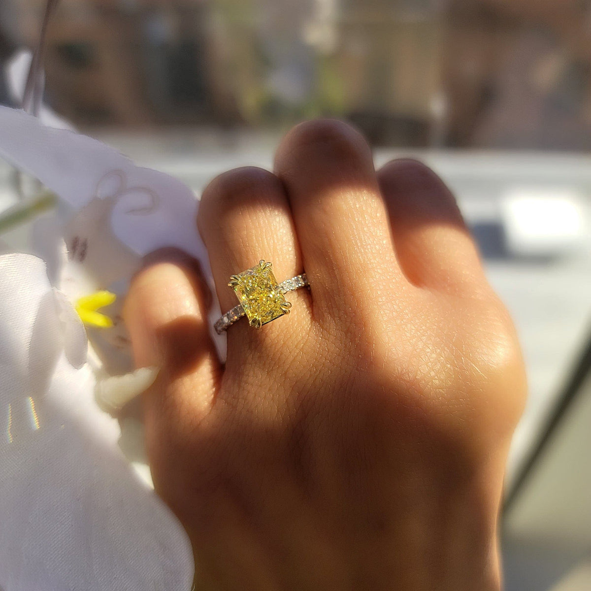 Fancy light yellow canary radiant on finger