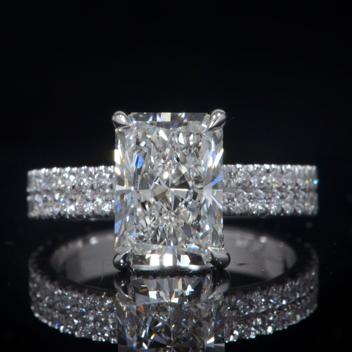 250ctradiantcutwithhiddenhalo_diamondsonprongs2rowshankring 00