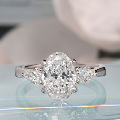 oval cut with pear cut diamond 3 stone ring front view