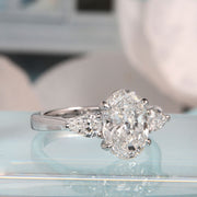 oval cut with pear cut diamond 3 stone ring side2 view