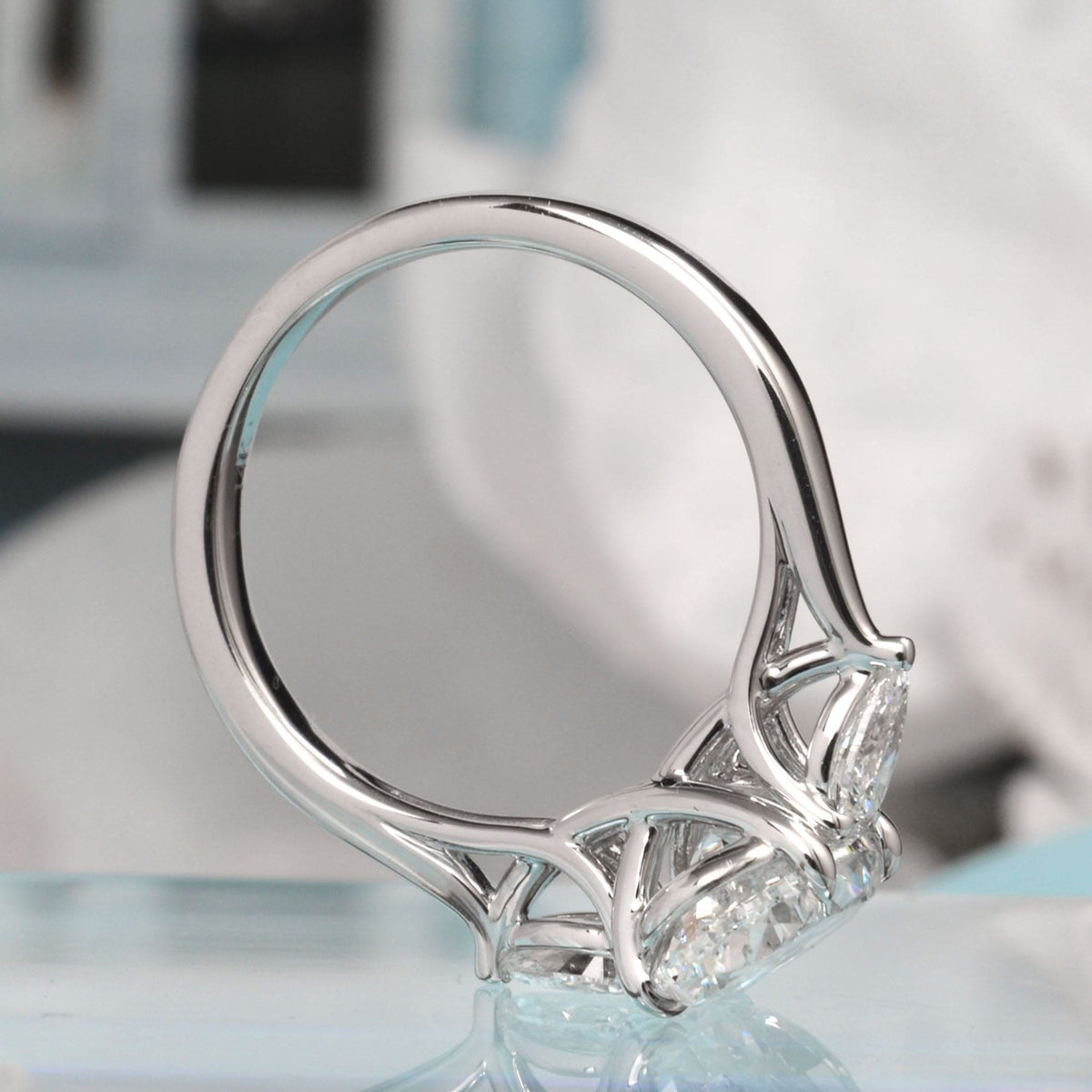 Oval cut with pear cut diamond 3 stone ring top view