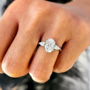 oval cut with pear cut diamond 3 stone ring on finger view