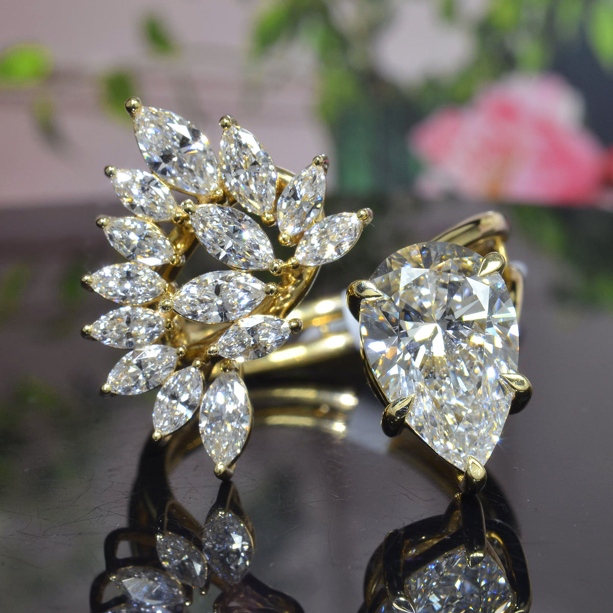 Pear cut and marquise cluster diamond bypass ring in yellow gold front view