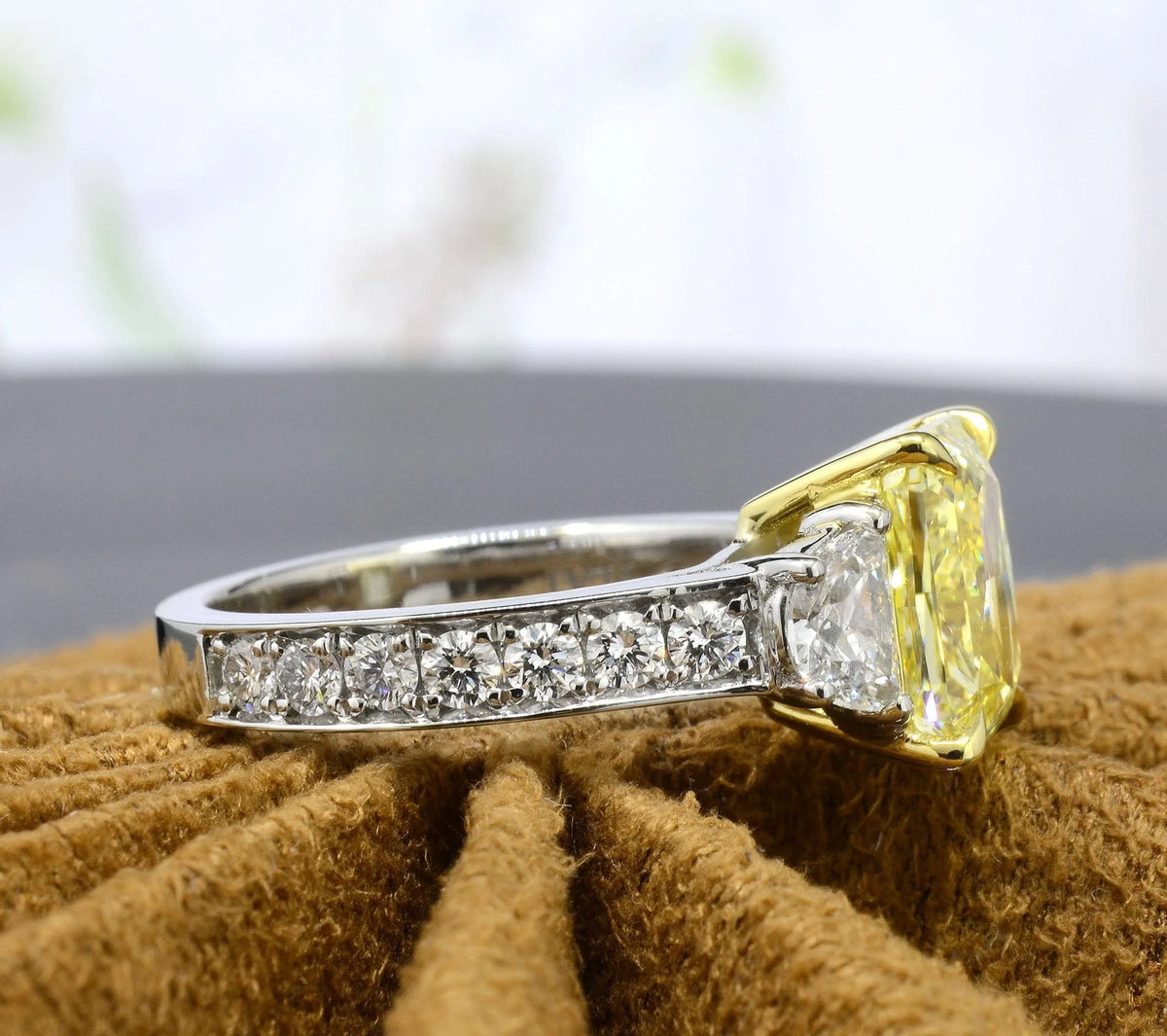 Rectangular radiant cut yellow diamond with half moons and round cut pave diamond ring side profile