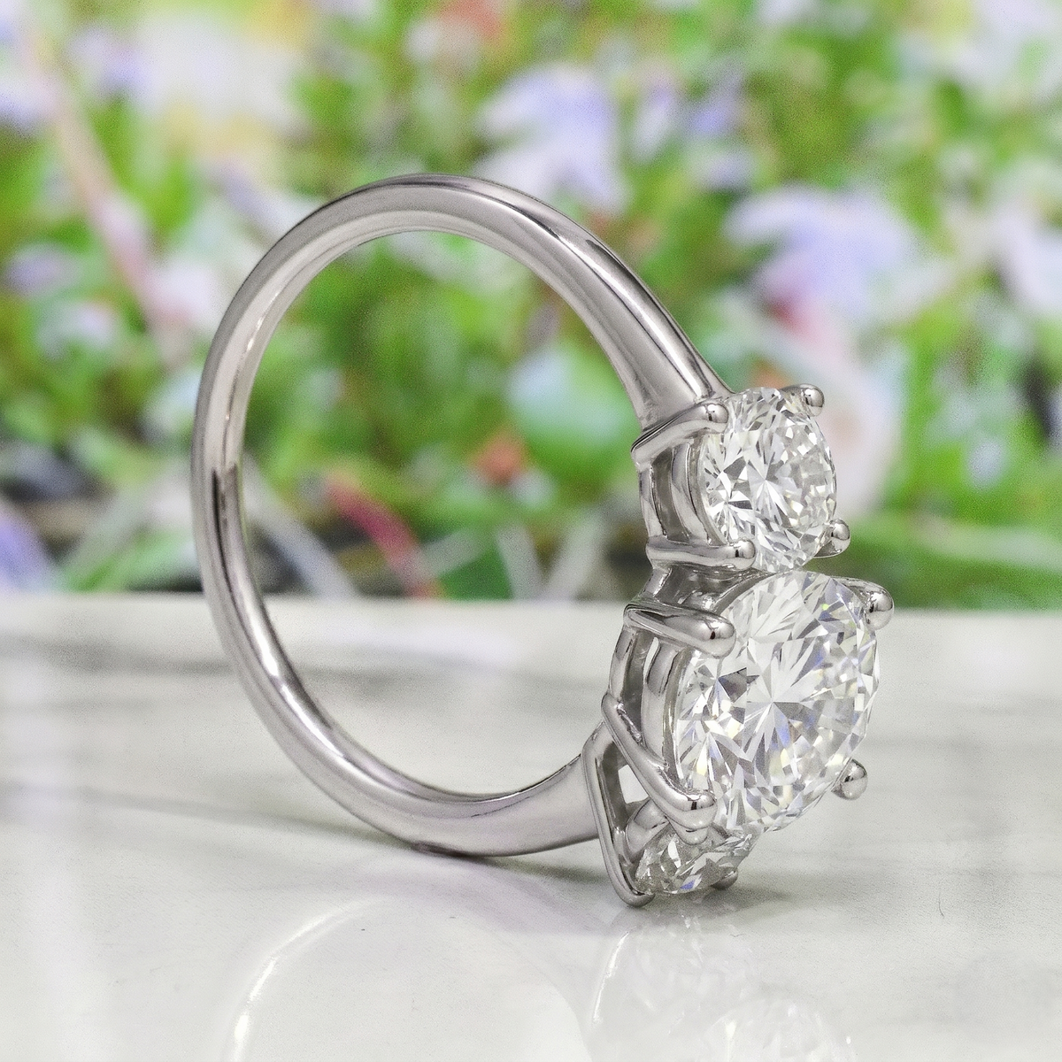 3 stone round cut diamond ring in white gold side view