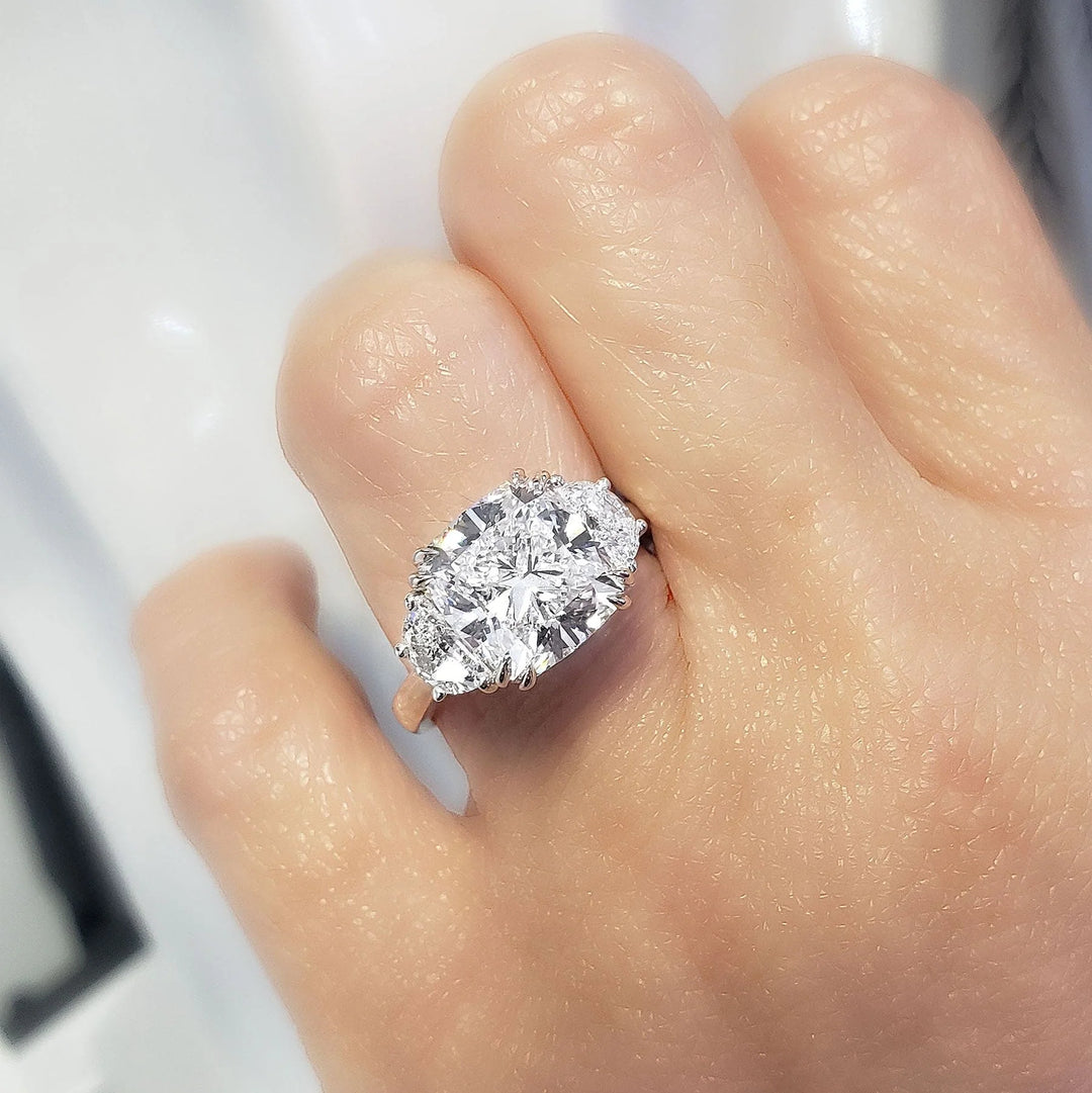 Cushion Cut & Half Moon 3-Stone Diamond Ring in white gold on model ring finger
