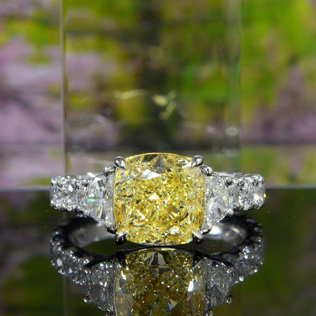 Cushion cut fancy yellow with halfmoon and large round cut -allwhite metal or platinum
