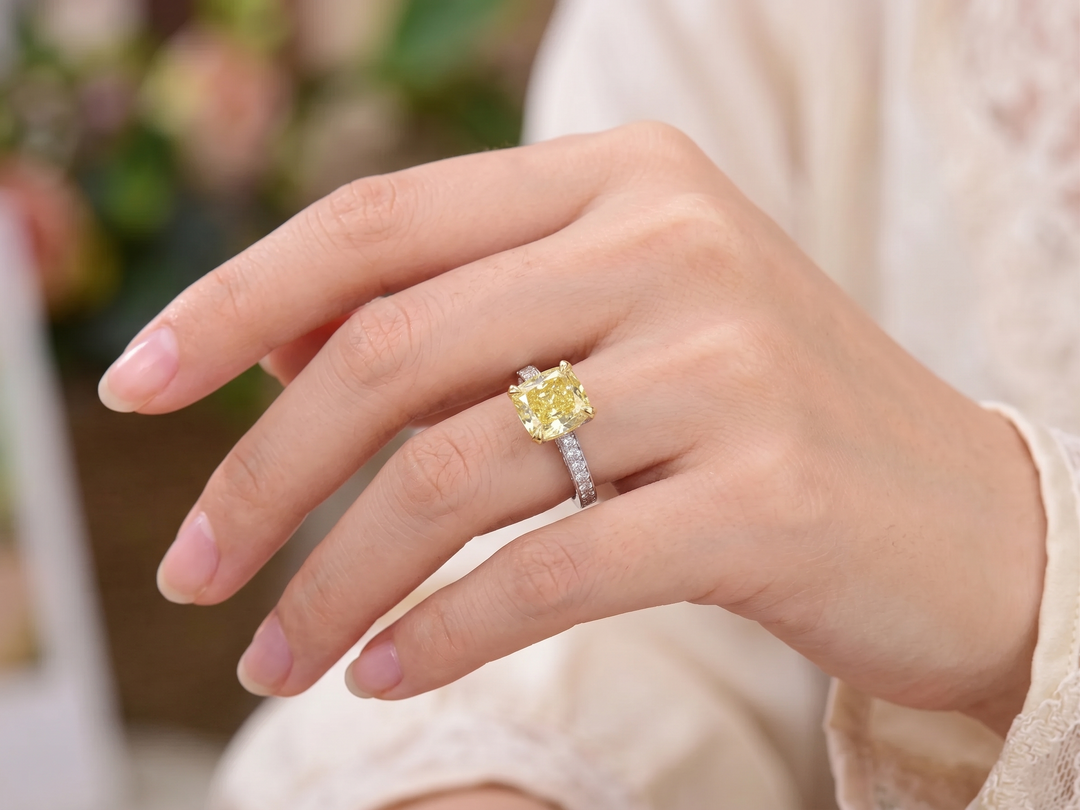 Cushion yellow diamond pave ring in white gold on hand model
