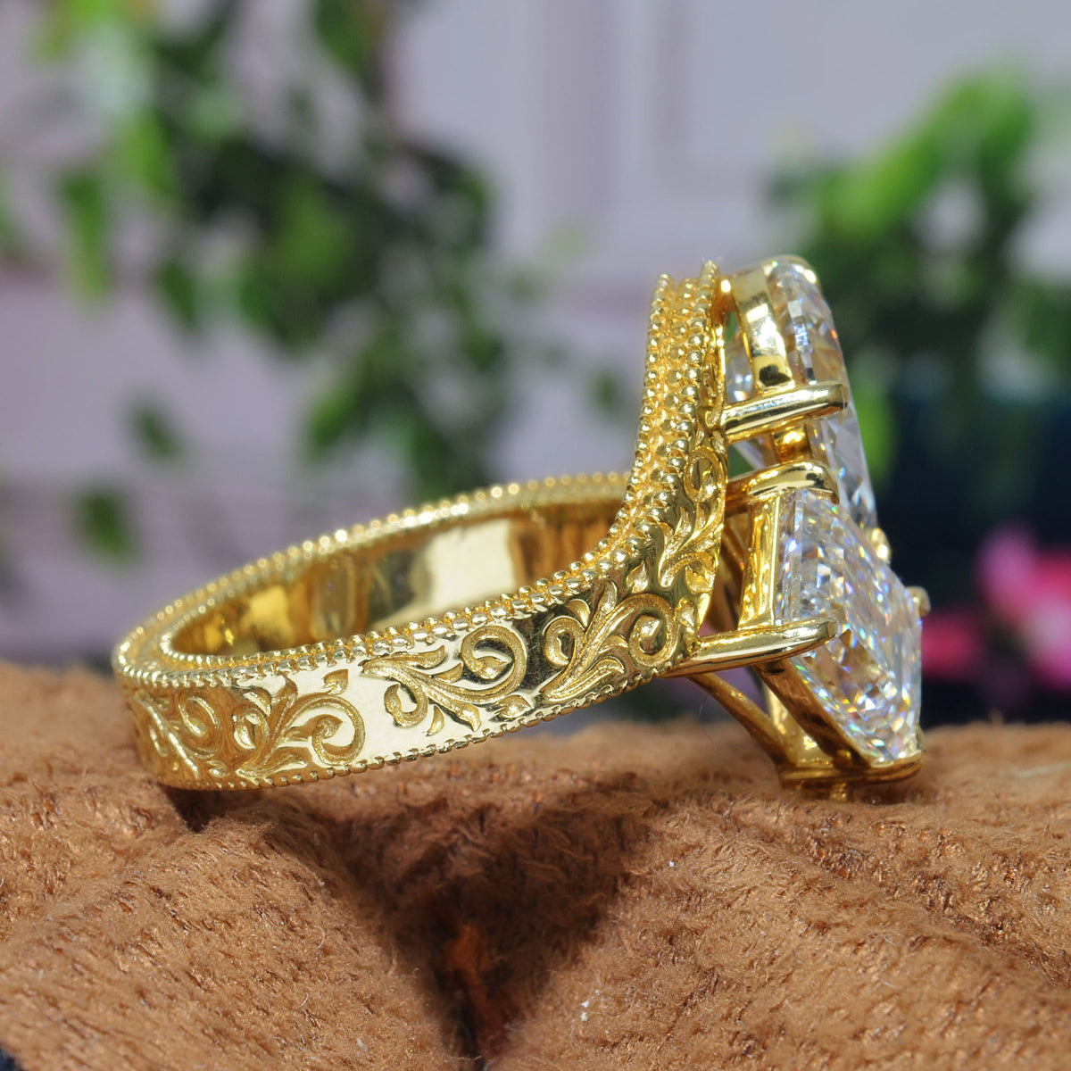 Toi et moi emerald & pear diamond bypass ring with engraving details on shank  in yellow gold side view