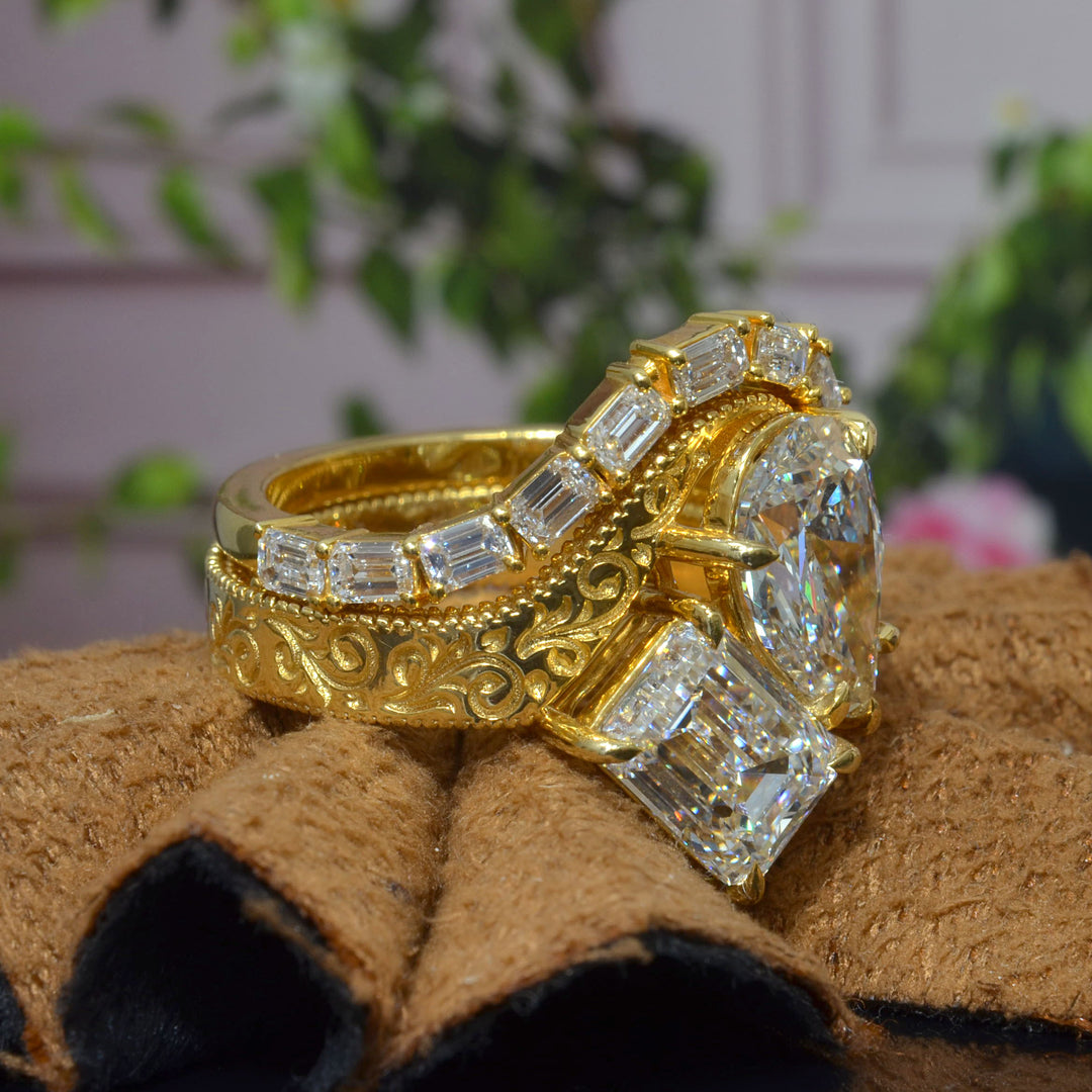 Toi et Moi Emerald & Pear Diamond Bypass Ring with engraving details on shank with curved emerald cut matching band in yellow gold side angle view