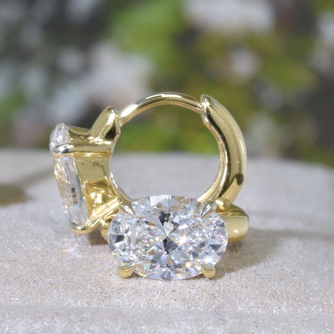 Oval Cut Diamond hoop earrings in yellow Gold