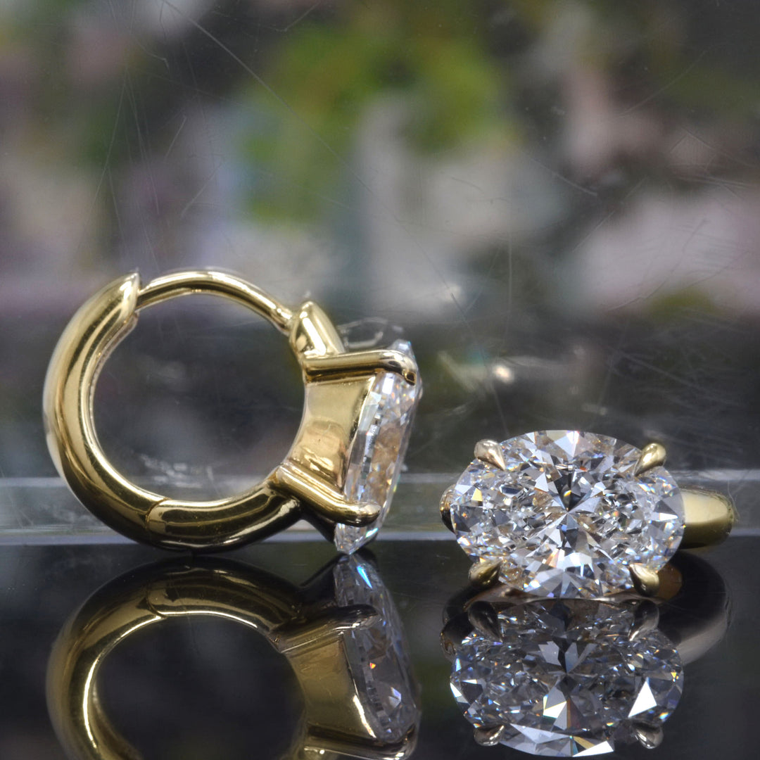 Oval Cut Diamond hoop earrings in yellow Gold