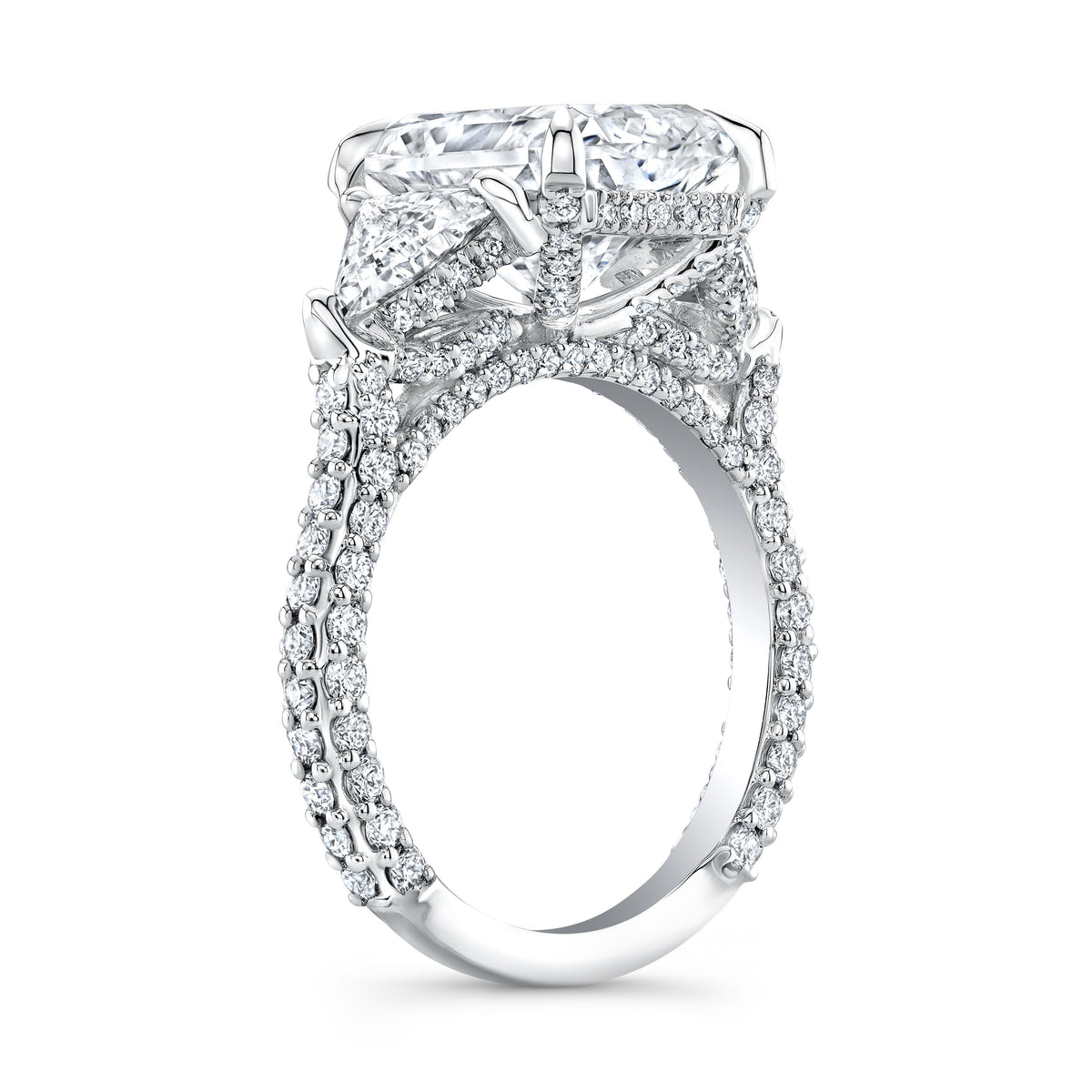 Elongated radiant cut 3 stone ring with trillions side view
