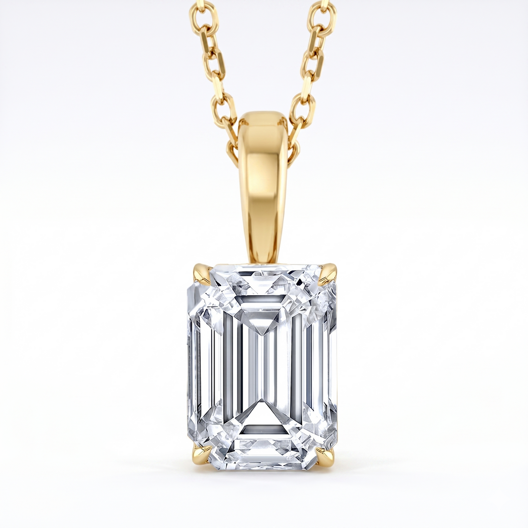 Emerald Cut solitaire Pendant with chain in yellow gold front view