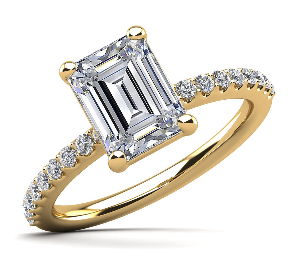 Emerald cut solitaire with side diamonds yellow