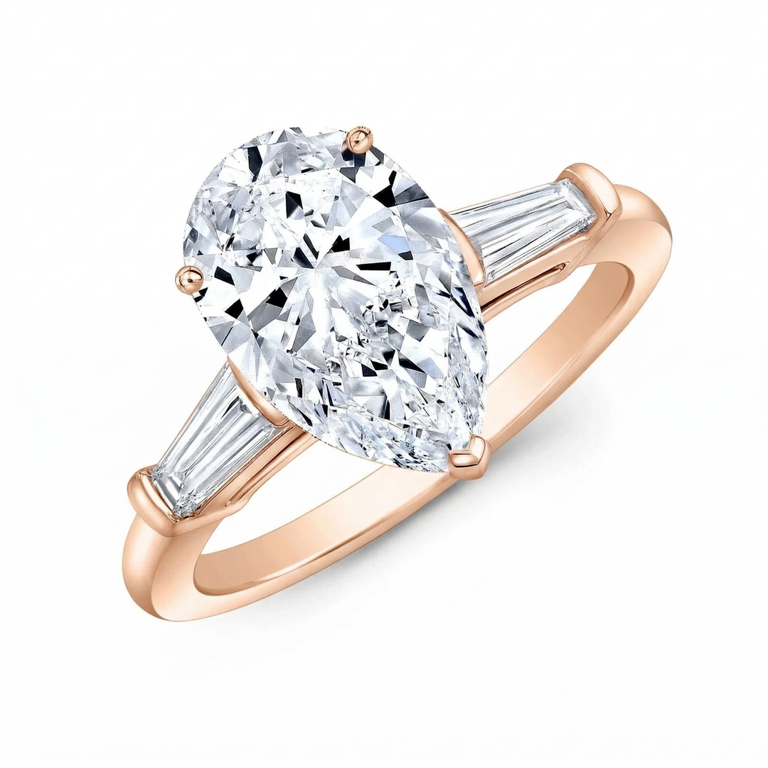 Pear cut diamond center and baguette side in rose gold  
