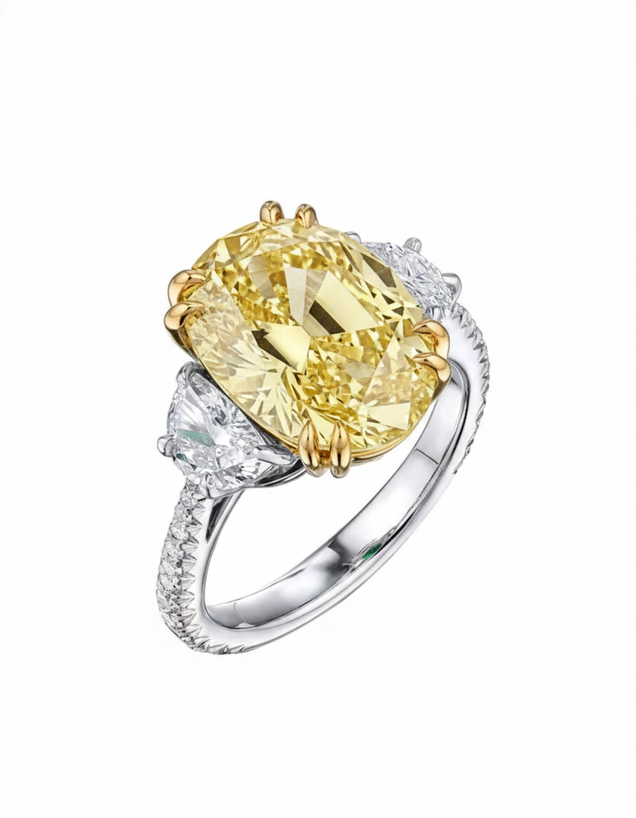 Yellow oval‑cut center with white half‑moon sides and round pavé diamond ring in white gold