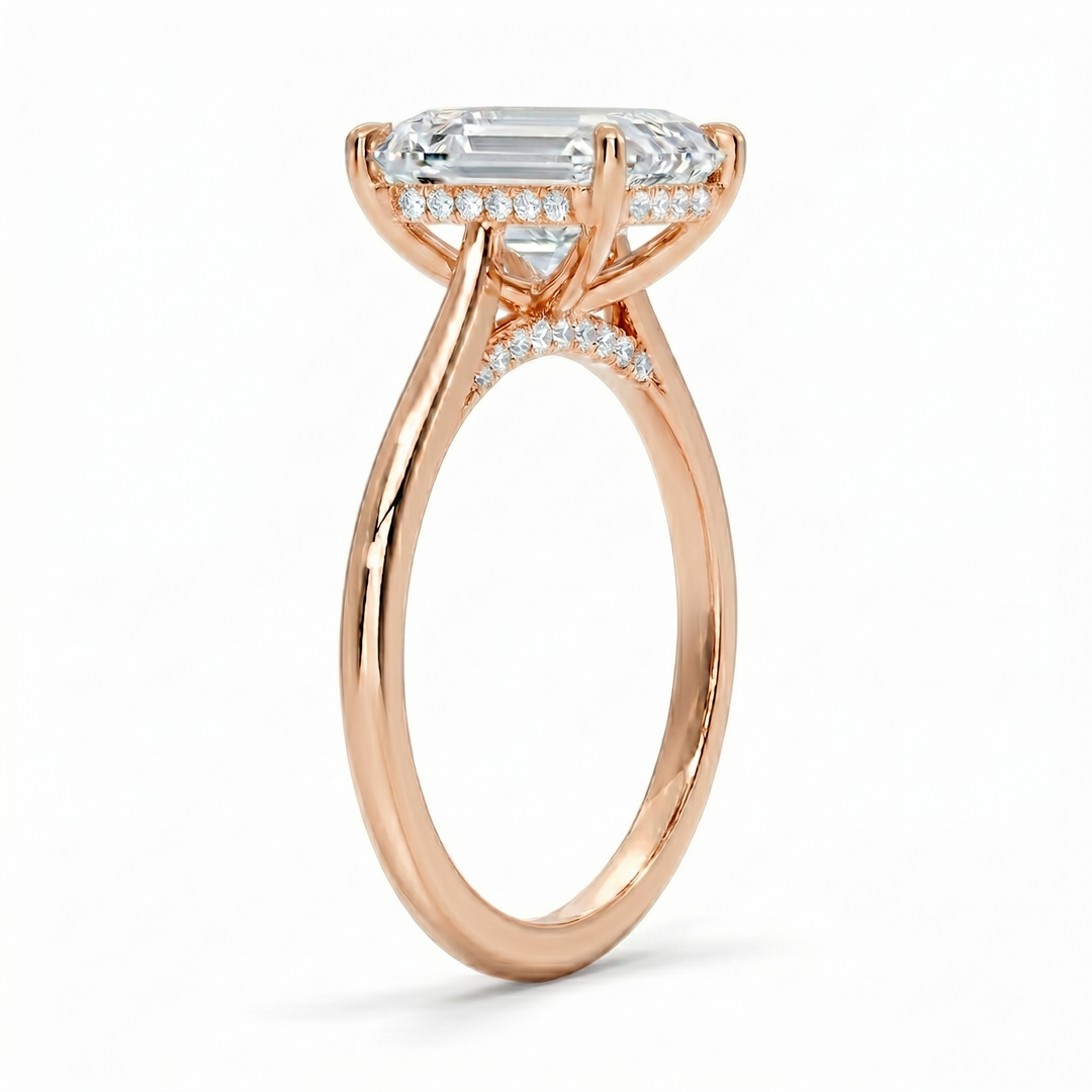 Hidden halo Emerald cut center diamond ring in rose gold side profile