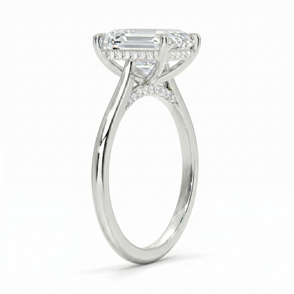Hidden halo Emerald cut center diamond ring in white gold side profile