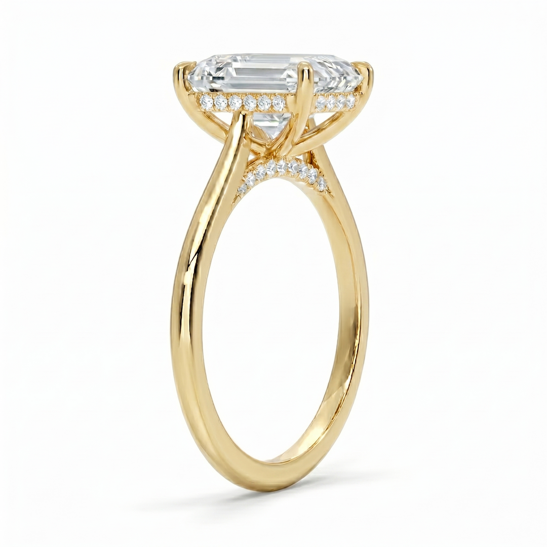 Hidden halo Emerald cut center diamond ring in yellow gold side profile