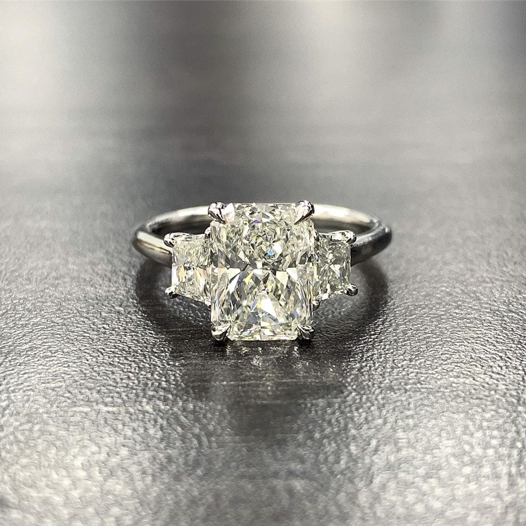 Elongated Radiant Cut center with Trapezoid side 3-Stone Diamond Ring in white gold