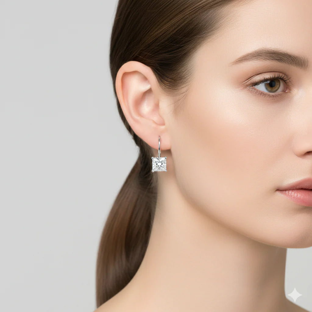Princess Cut Lever Back Diamond Earrings in white gold on model's ear