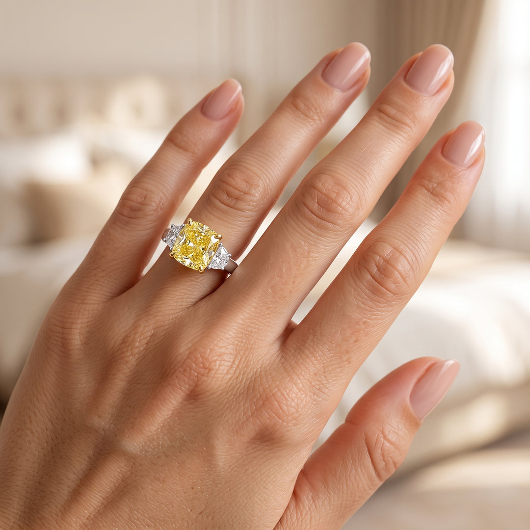 Model wearing yellow cushion and white half moons on a two tone ring