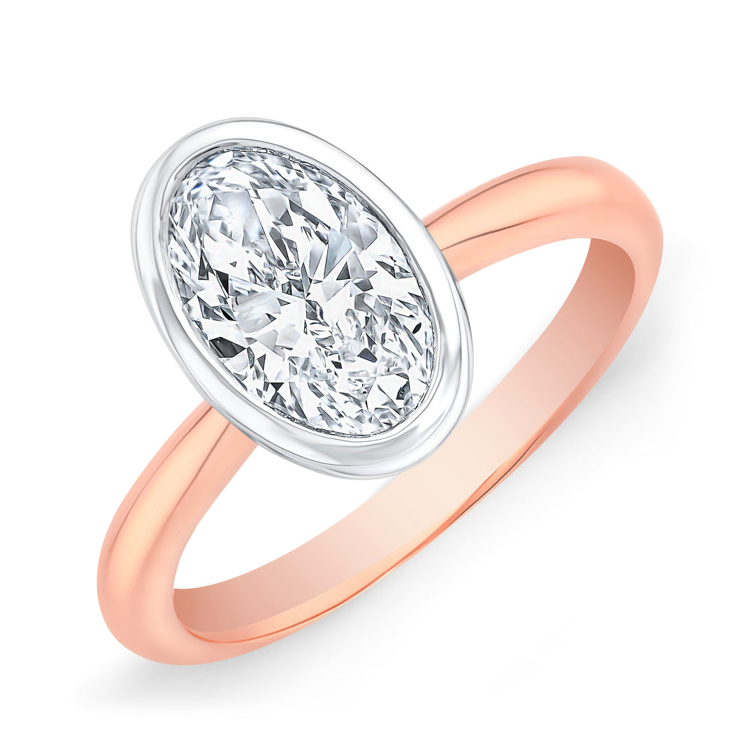 Oval Cut Bezel Set Diamond solitaire ring in white gold bezel with rose gold band