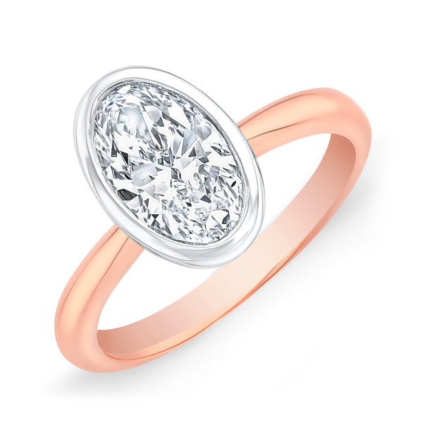 Oval Cut Bezel Set Diamond solitaire ring in white gold bezel with rose gold band