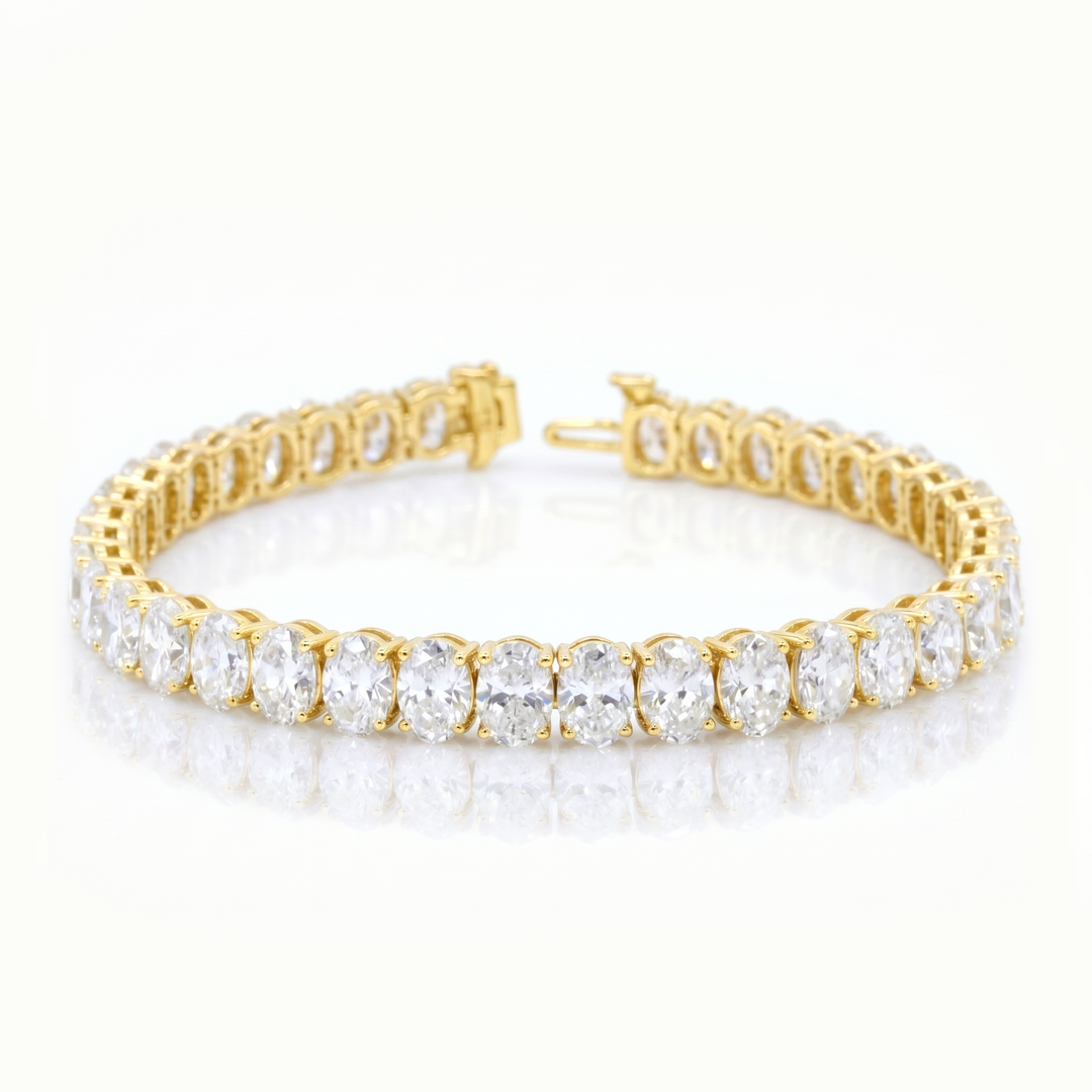 oval shape Diamond yellow gold bracelet on a white background