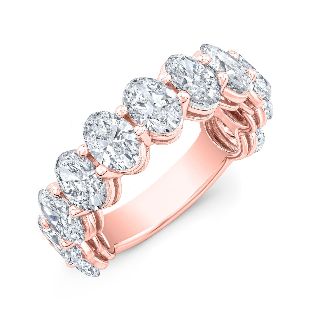 An 11 stone oval cut diamond 3/4 way eternity ring with a rose gold band.