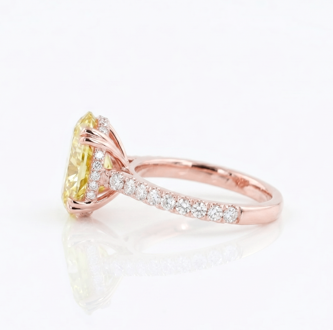 Oval Cut Diamond with Round Cut Pave in rose gold ring side view