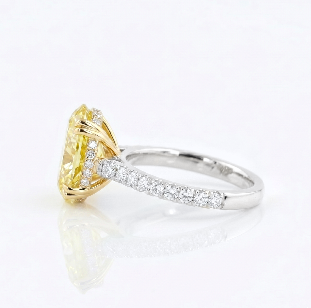 Oval Cut Diamond with Round Cut Pave in yellow & White gold ring side view