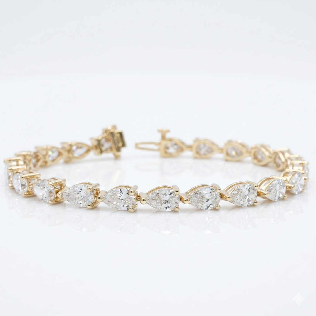 pear cut Diamond bracelet yellow metal on a white background