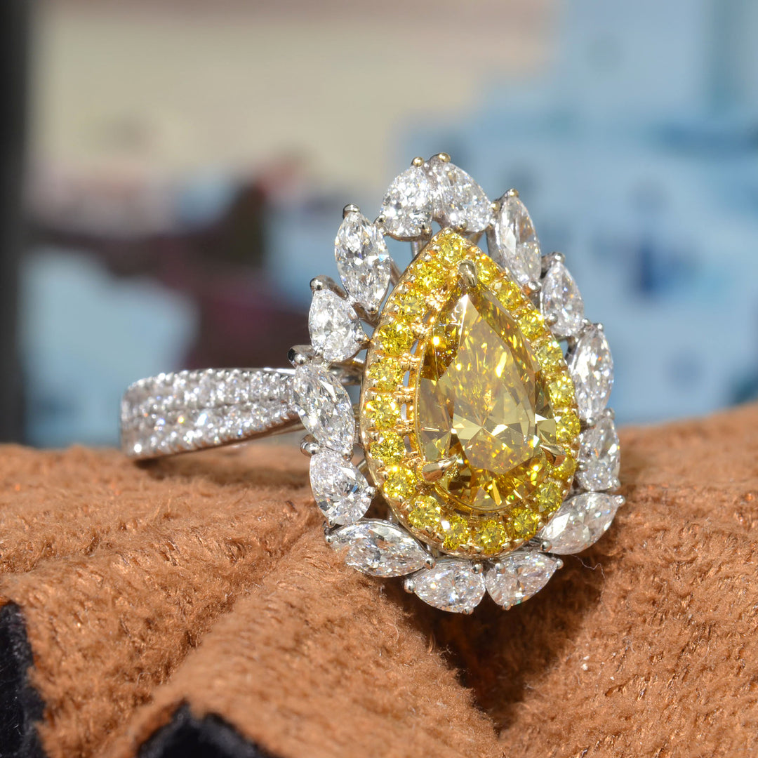 Pear Cut Yellow Diamond center with Double Halo of Marquise and Pear & Yellow Round cut with 2 row shank Diamond Ring side angle view