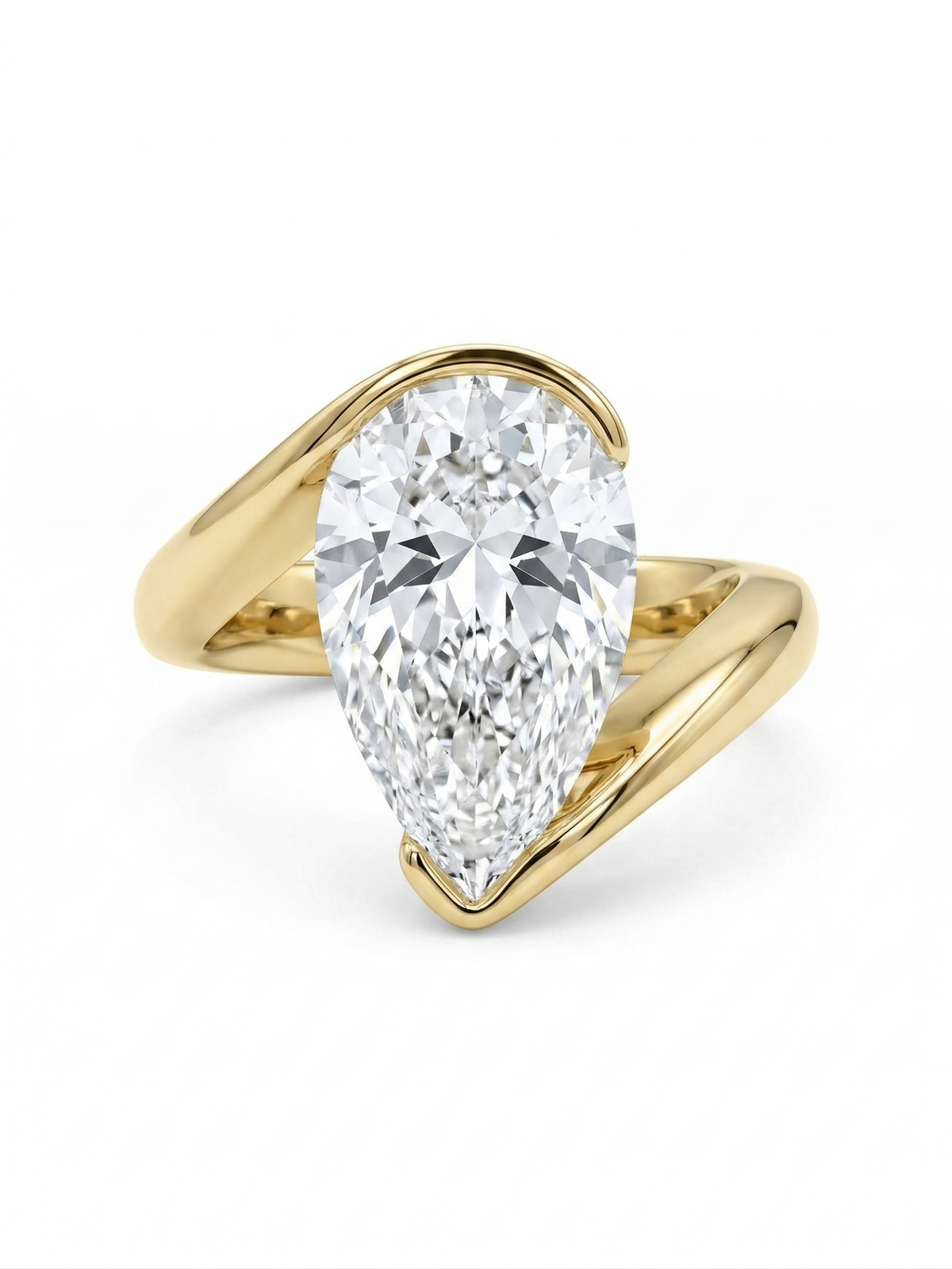 Pear cut diamond solitaire bypass ring in yellow gold