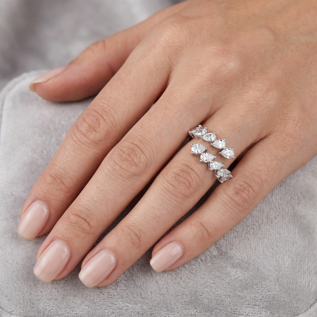 10 stone Pear cut Bypass diamond ring in white gold on model's ring finger