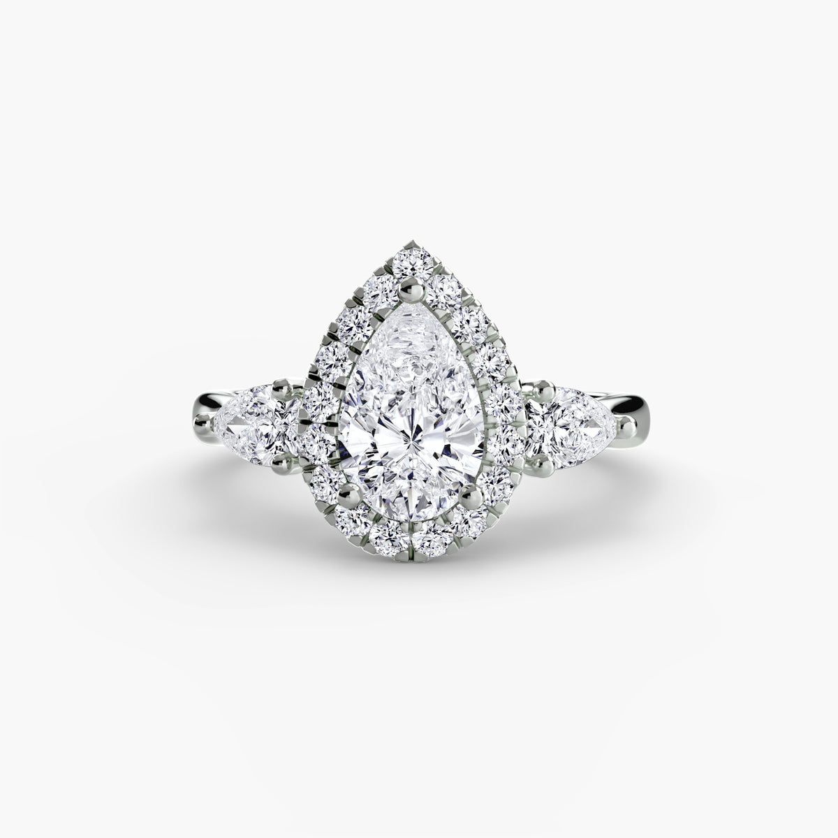 Three stone ring with halo