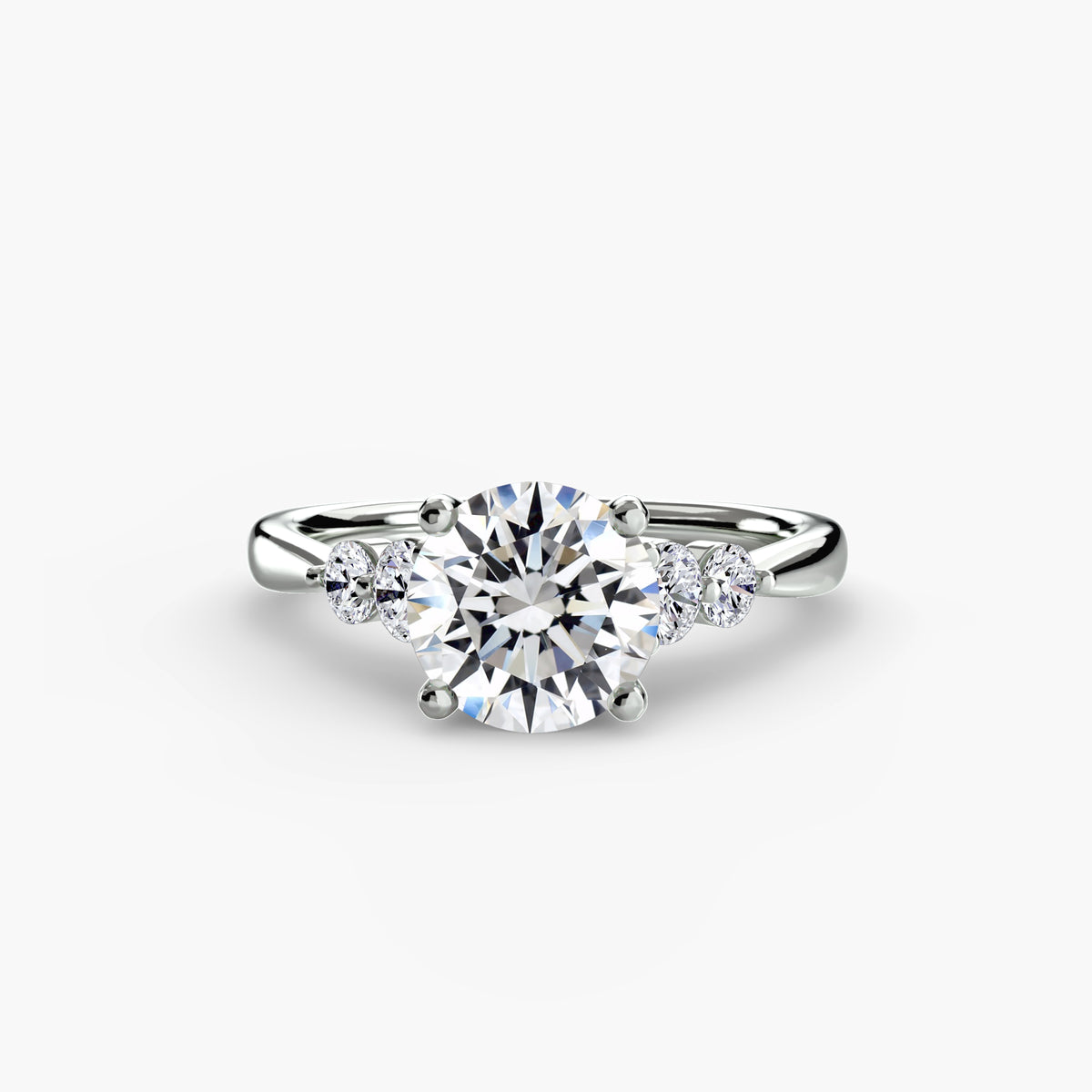 Solitaire with round cut shoulder accents